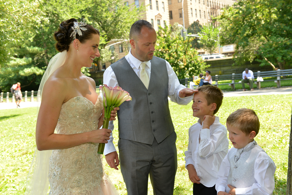 bride and groom with 2 ring bearers