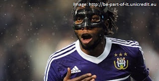 Dieudonne Mbokani in a mask