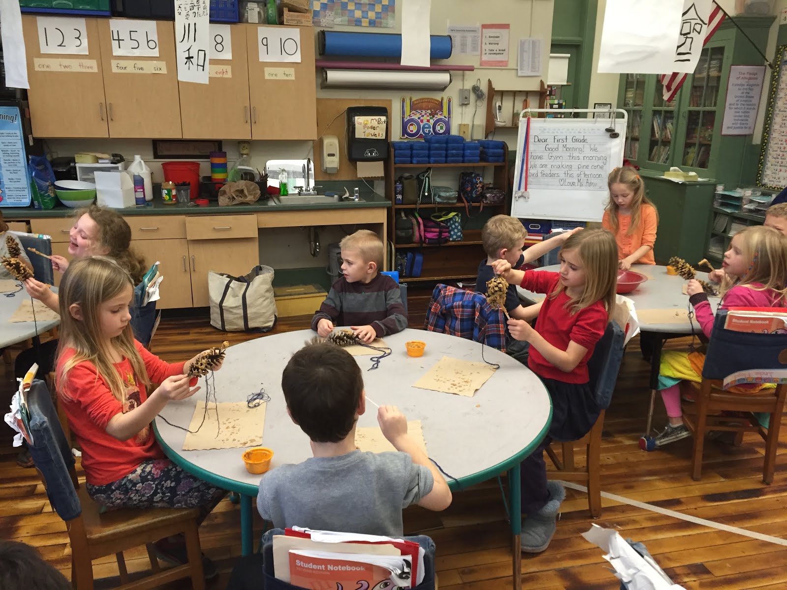 After reading "The Night Tree", we made pine cone bird feeders and hung them on our trees.