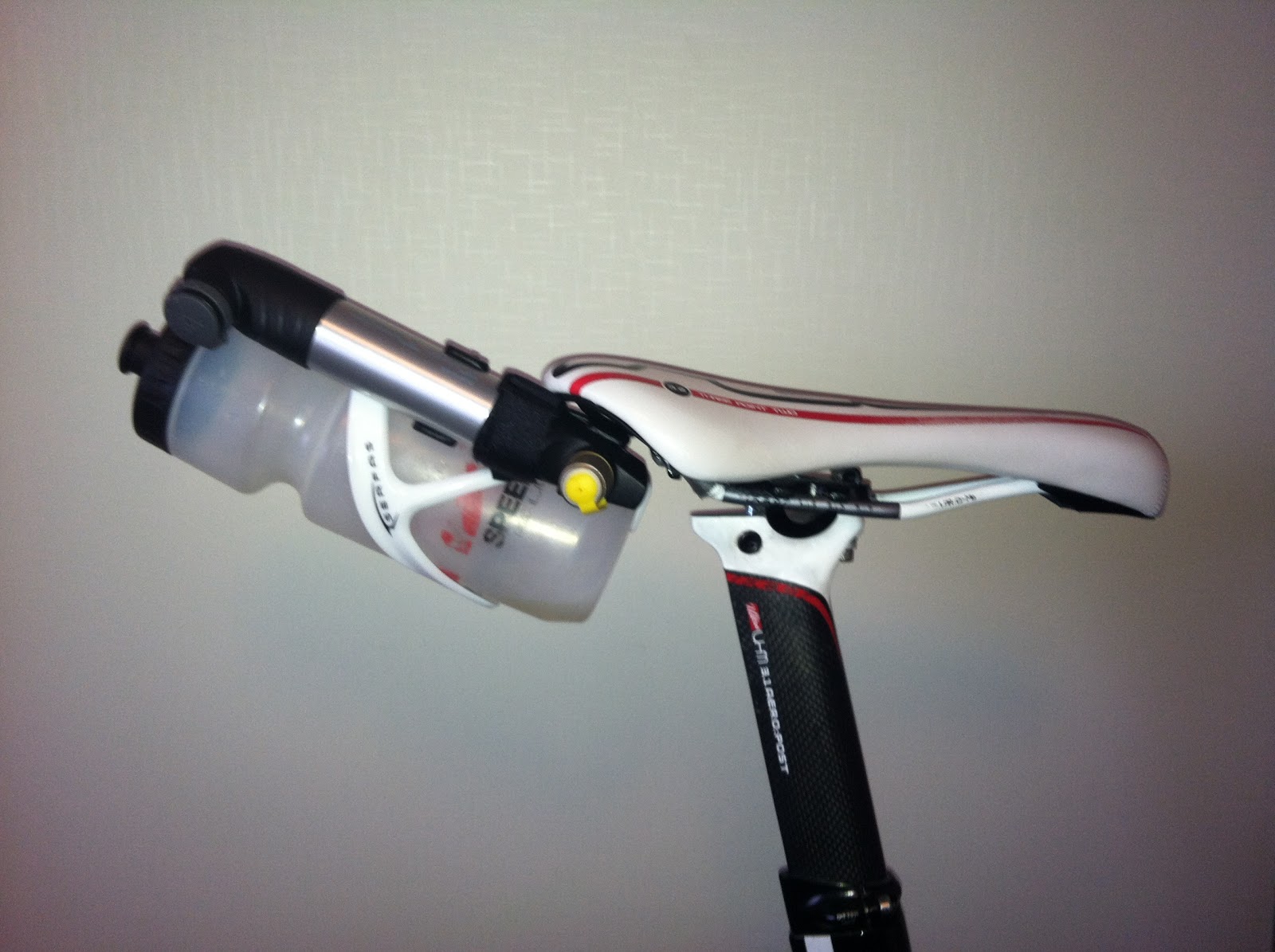 behind the saddle bottle holder