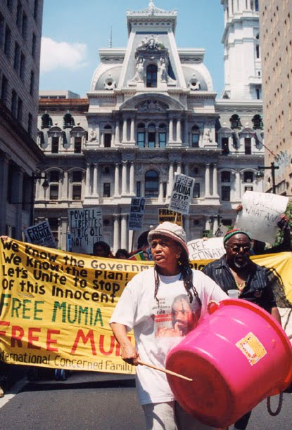 Pam Africa leads a Free Mumia demonstration past Philadelphia City Hall (July 4, 2002)