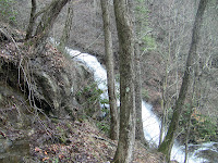 View of falls while climbing the wooden trail to the top