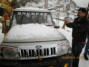 Jeep covered in snow. and ice.