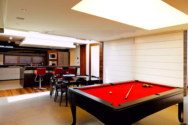 Picture of red pool table in the living room