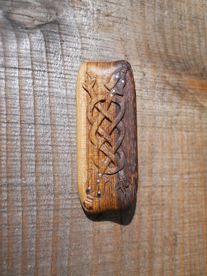 carved wooden kiltpin