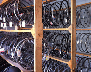 Couple racks full of replacement wheels. We have another room full of Easton & Bontrager wheels too.