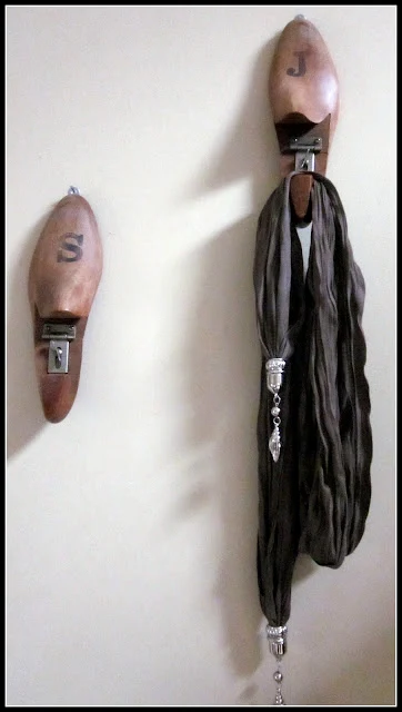 shoe stretchers hung on the wall