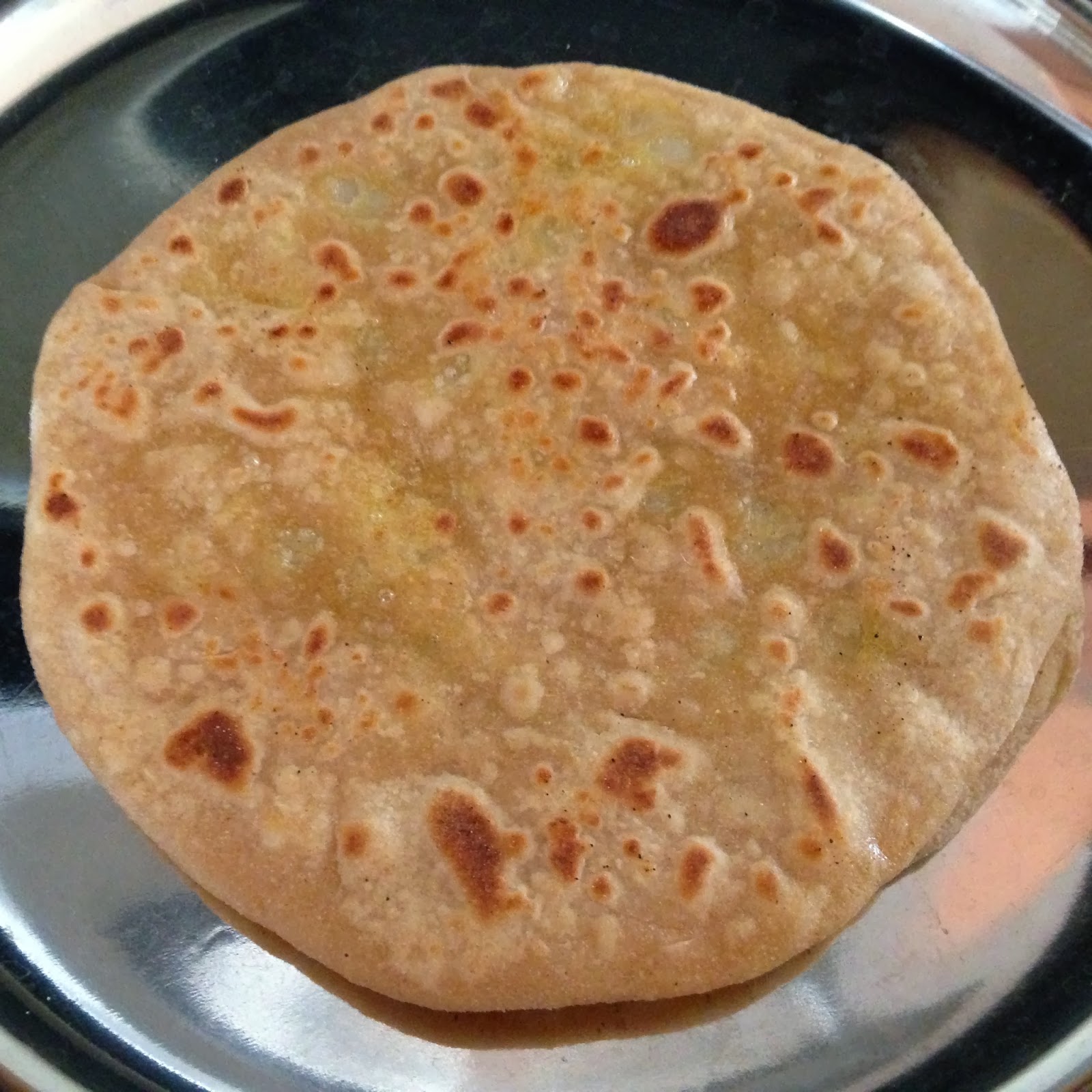 Aloo Paratha ( Indian flat bread stuffed with spiced potatoes ) With
