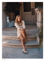 Paris Hilton leggy in shorts sitting on stairs