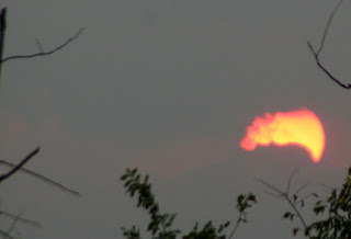 Sun through clouds as it sets Sun through clouds as it sets