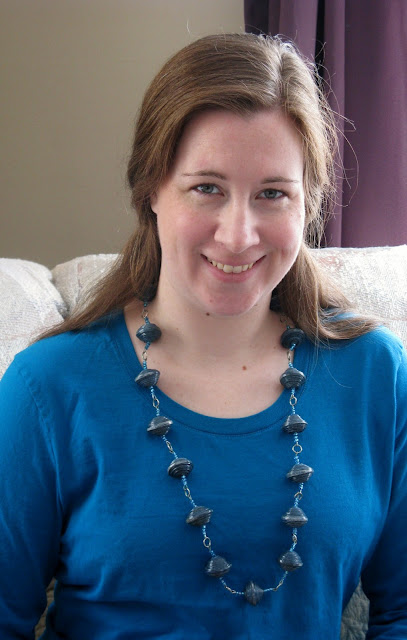Rachel wearing a necklace made at Mercy House
