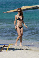 Maria Menounos looking super hot in a black string bikini on the beach in Myconos Greece