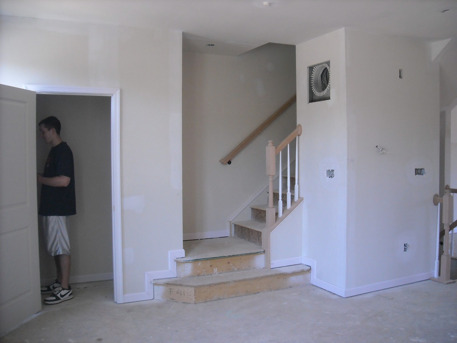 Unfinished maple kitchen cabinets Stairs leading to 3rd floor
