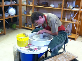 Lori Buff of Future Relics Gallery testing the Shimpo VL Lite pottery wheel