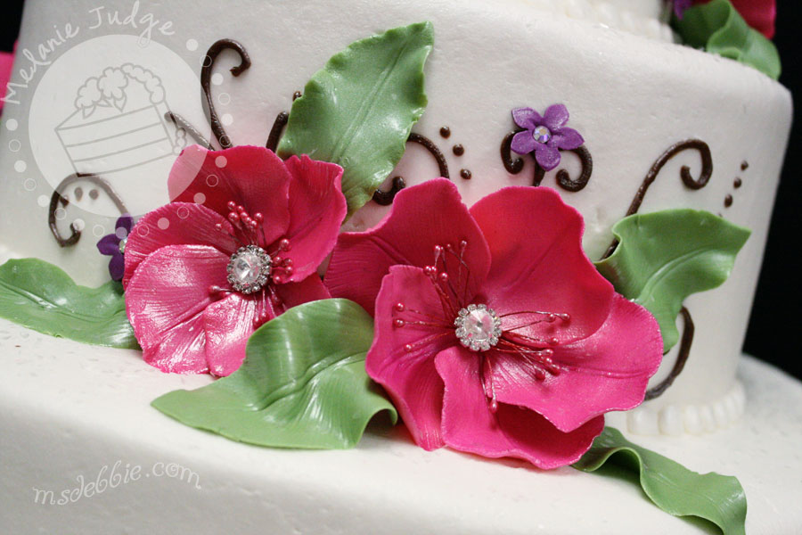 buttercream wedding cake gum paste flowers with rhinestones pink purple