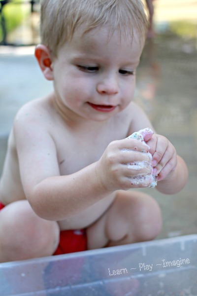 Soapy sensory play with clean mud