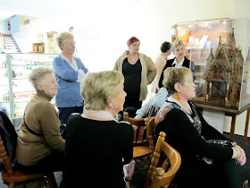 A group of customers waiting for the raffle to be drawn at the Fairy Meadow Miniatures shop VIP opening.