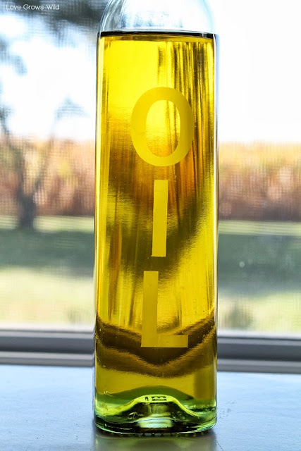Learn how to create a gorgeous Etched Glass Oil Bottle for your kitchen! at LoveGrowsWild.com #diy #kitchen