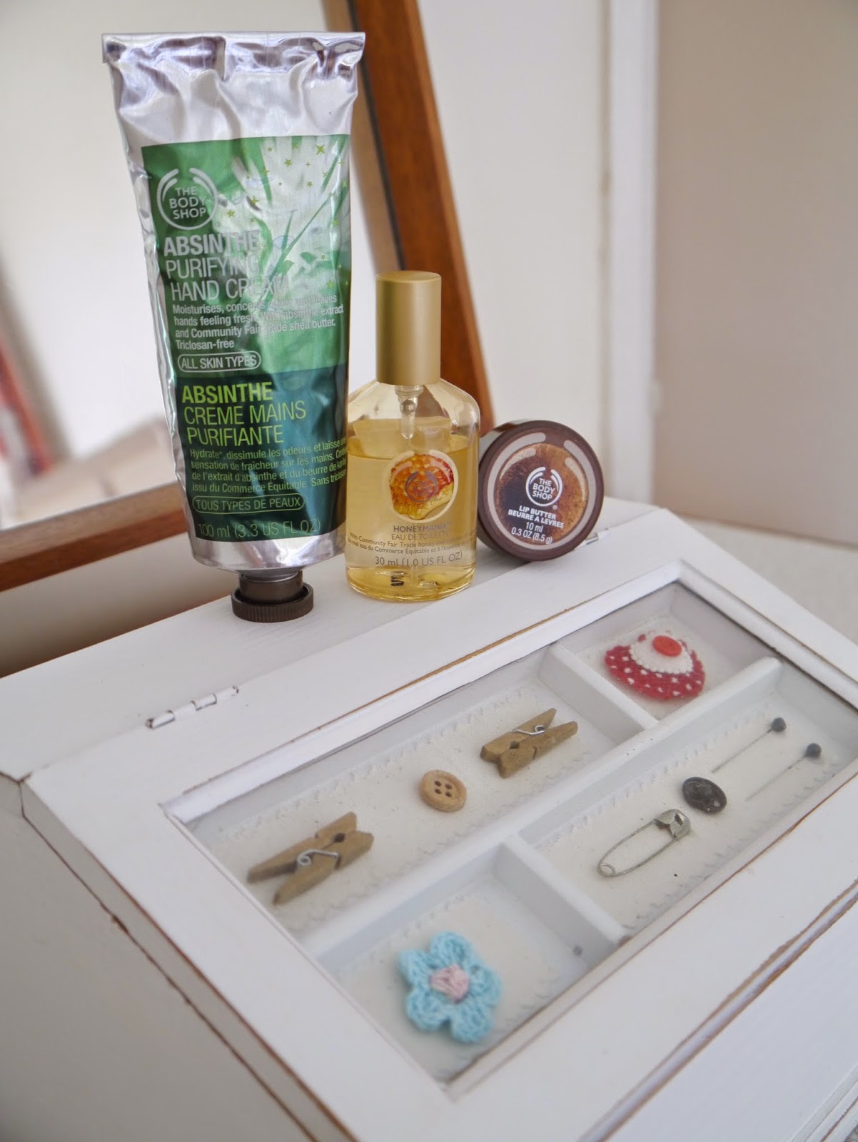photo of Body Shop Honeymani Eau de Toilette, Body Shop Absinthe Purifying Hand Cream, Body Shop coconut lip butter 