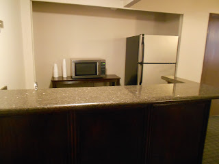 a kitchen with a microwave and refrigerator