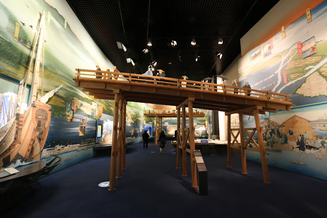 A jetty bridge connects from the land to the ships and boats at Museum of History in Osaka, Japan A jetty bridge connects from the land to the ships and boats at Museum of History in Osaka, Japan