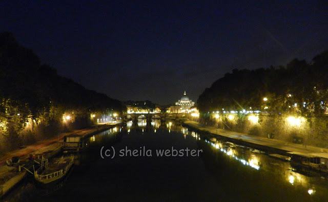 We look down the river to see the lights of the walks and St. Peter's Basilica