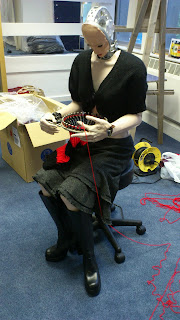 Knitting Robot working on a knitting loom