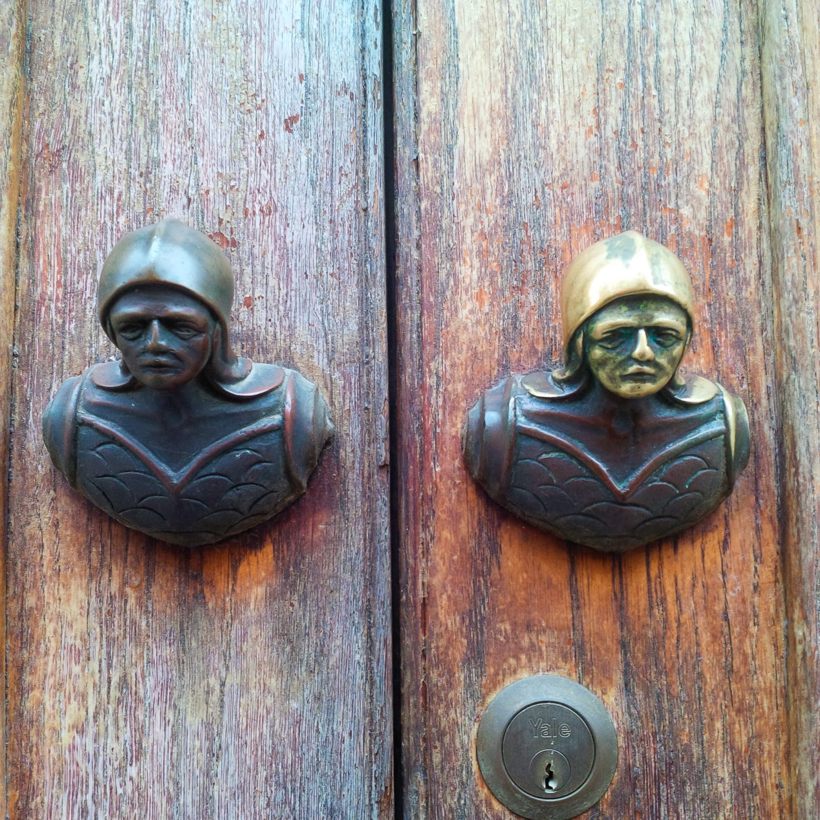 Soldiers' heads door handles as seen in Vicenza, Italy