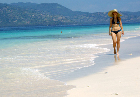 samantha brown walking on the beach