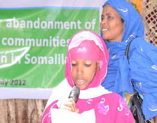 Hamda reading the public declaration for the abandonment of FGC and child/forced marriage.