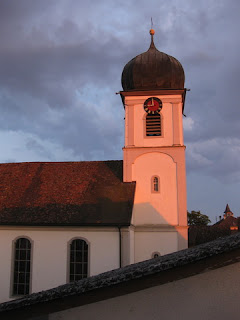 Sunset glow on the church's bell tower, Ramsen, Switzerland.