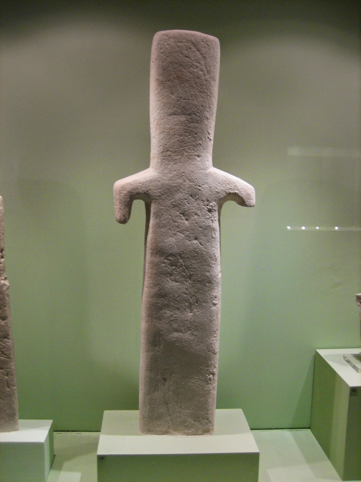 A later stone representation of an xoanon. The Orthia was a wooden pillar.