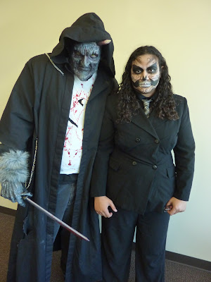 Man and woman posing in Scary Costumes for halloween