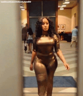 Jhonni Blaze dressed in a fetish outfit walks out the door, curyv woman 