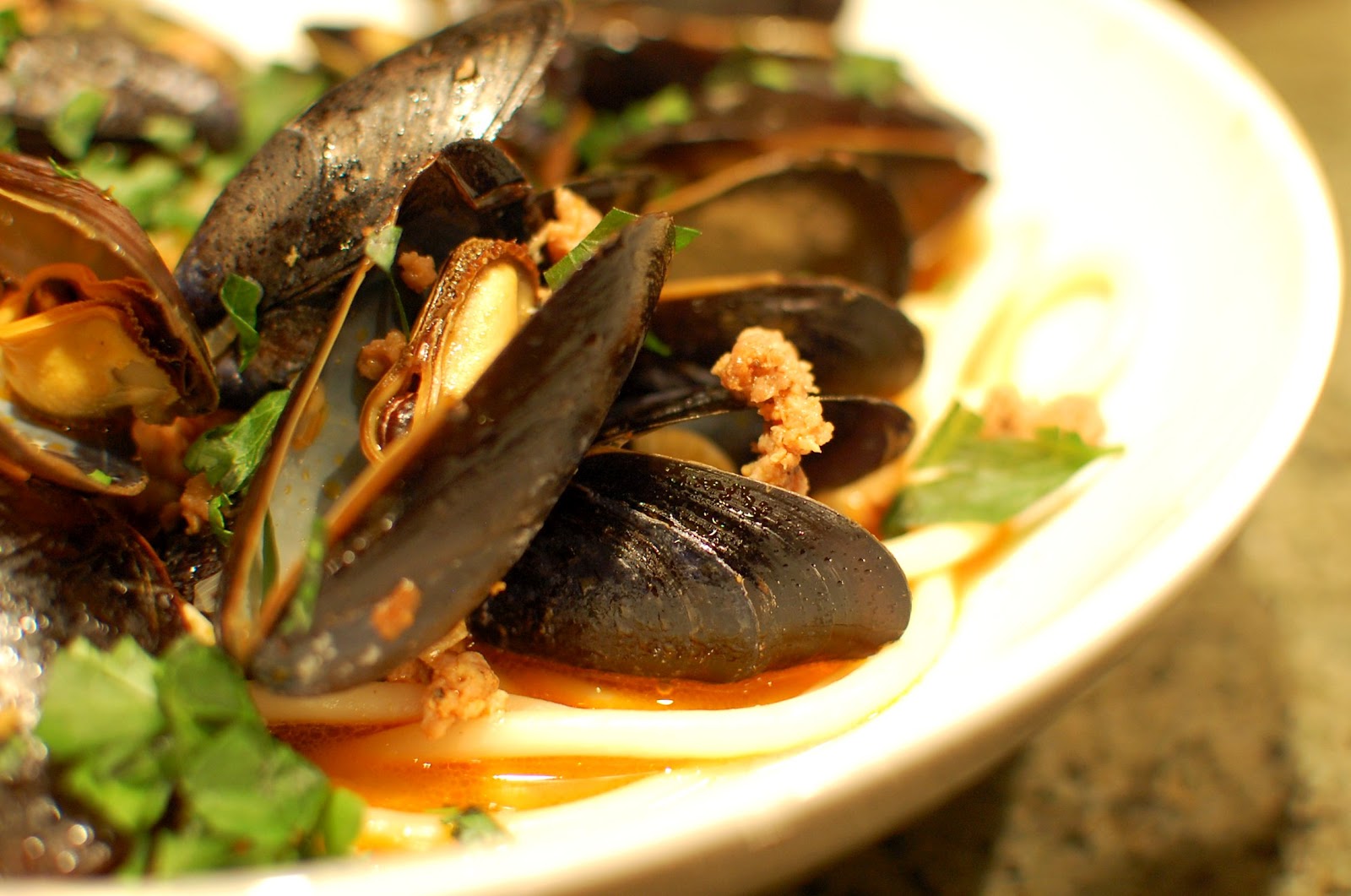 Reckless Abandon Steamed Mussels with Italian Sausage over Pasta