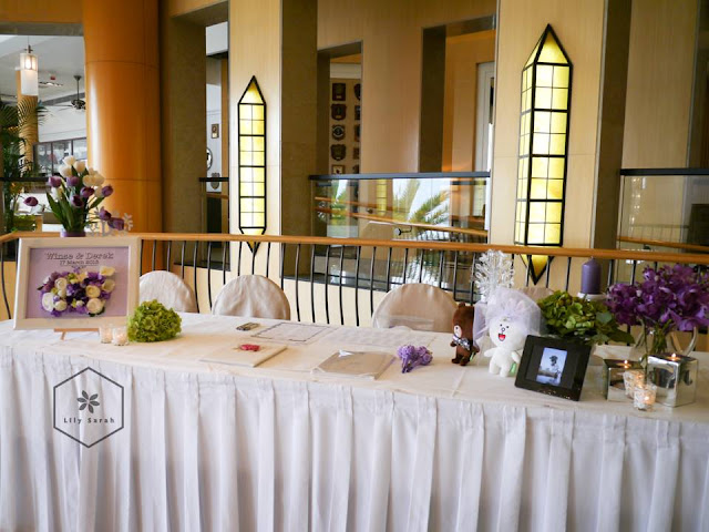 purple wedding reception decoration and welcome board