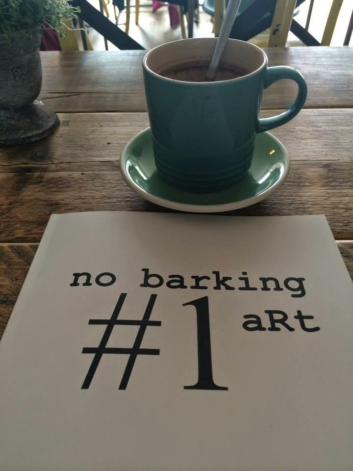 no Barking art Issue 1 Magazine cover laid on a table in front of a cup