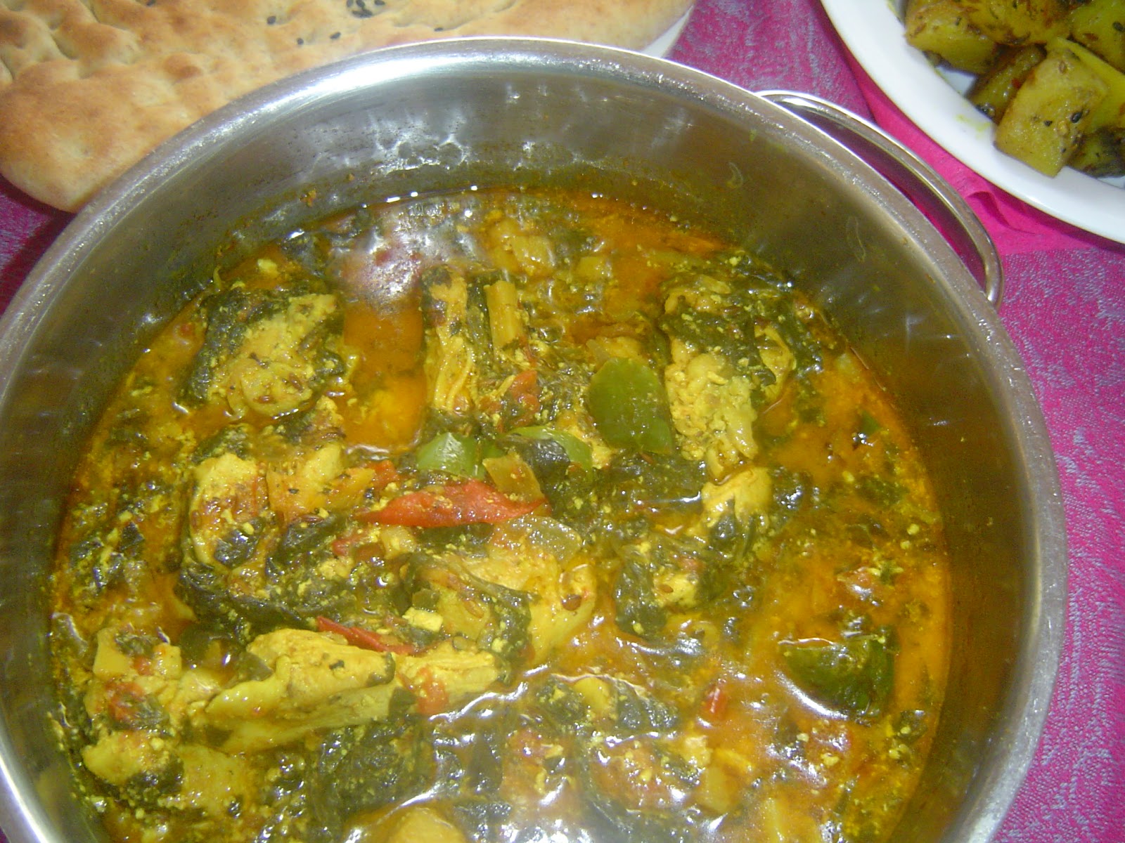 pakistani home cooking Chicken and spinach in coconut sauce curry