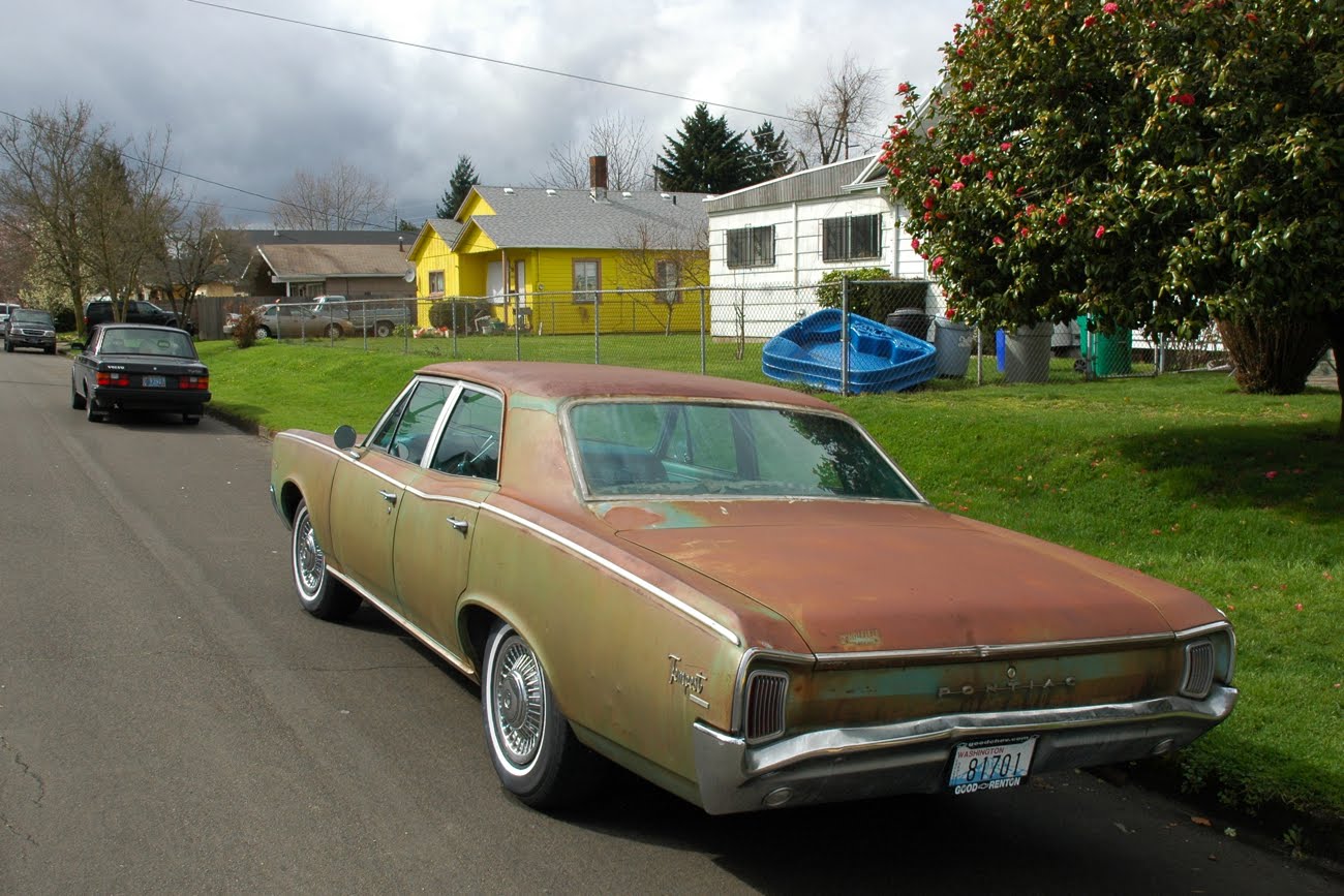 OLD PARKED CARS. 1966 Pontiac Tempest Custom.