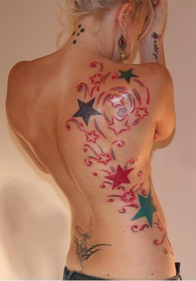 Black and red star tattoos on back body