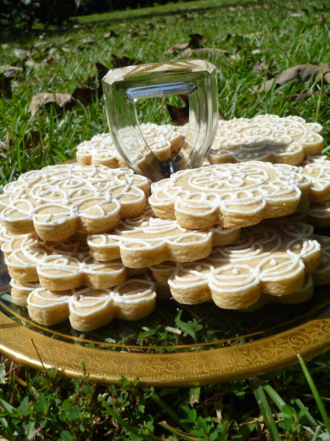 a picnic of beautifully decorated lemon-rosemary tea biscuits/cookies