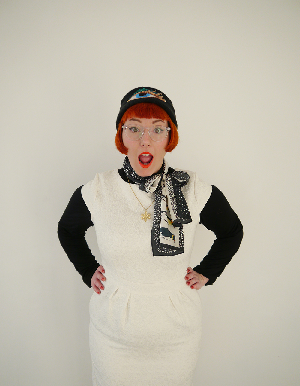 Snowman Style Unlikely Style Icon, Chritsmas Style Icon, Christmas style, snowman style, cute snowman costume, festive style, winter style, red headed blogger, red hair, ginger, Iolla glasses, #seewithiolla, Bershka Eye hat, sequin hat, fun winter hat, Karen Mabon, KAren Mabon scarf, Penguin scarf, Bonnie Bling, snowflake necklace, Bonnie Bling acrylic jewellery, Bonnie Bling necklace, winter necklace, gold snowflake necklace, white dress, short white dress, layering, layered style, Ted & Muffy, ted and muffy, ted and muffy boots, Victorian style ankle boots, witchy style boots, black ankle boots, Scottish blogger