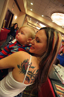 Tattooed Women with Rose Flower Tattoo Design on back body