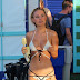 Kimberley Garner showcases her lithe body in a racy cut-out bikini as she treats herself to an ice cream on yet ANOTHER summer holiday 