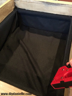 Stapling the fabric liner into place. Stapling the fabric liner into place.