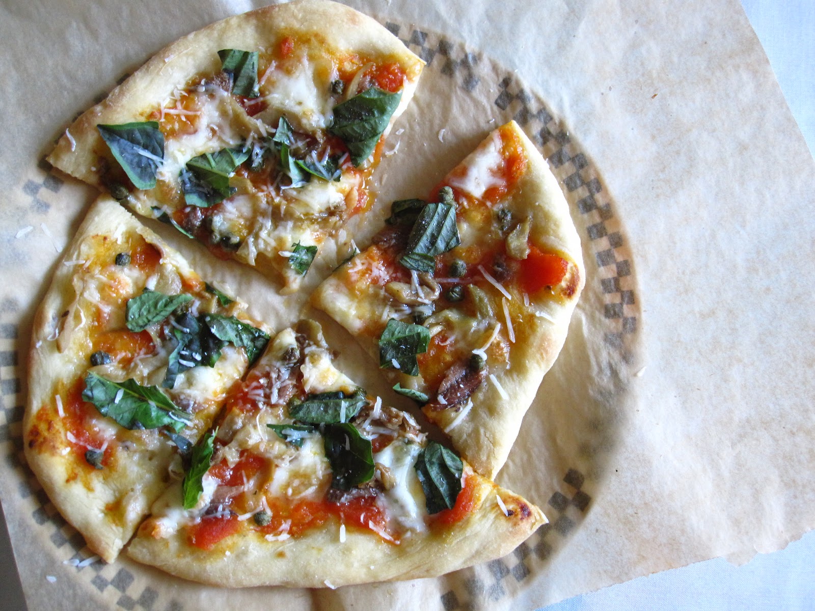 Edible biology Anchovy, caper and marinated eggplant pizza