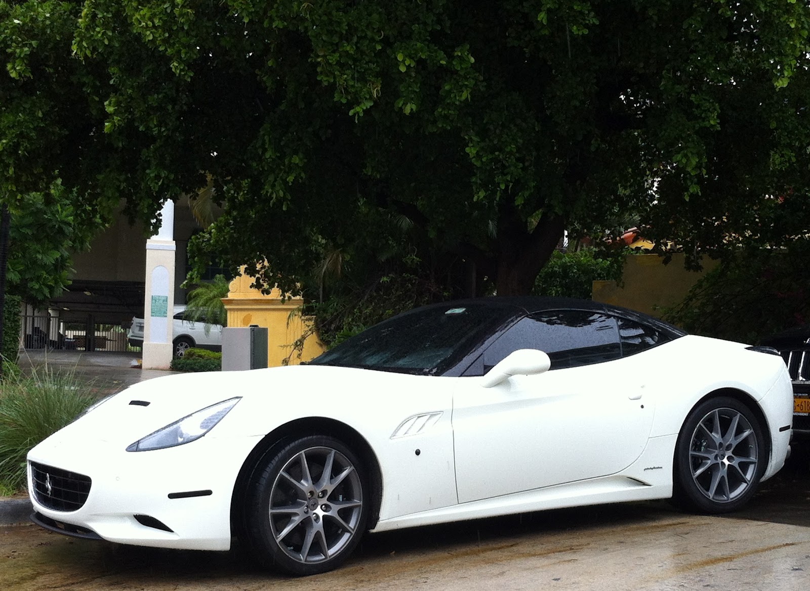 White Ferrari California with glass roof Exotic Cars on the Streets