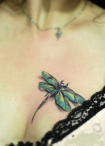 dragonfly tattoo design on the chest