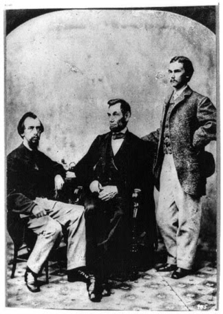 Lincoln sits with his private secretaries