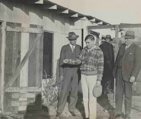 Gordon Northcott uses a pencil to show the chicken coop where one boy